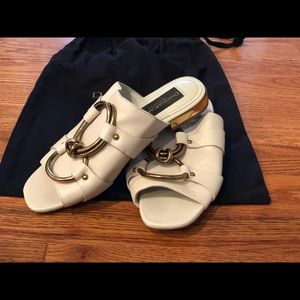 Donna Karan white slides.